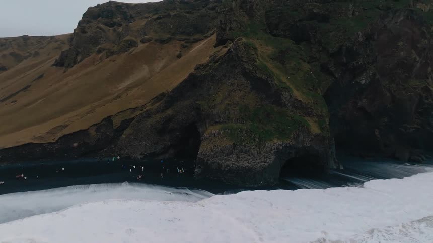 The tourists travel into the sea caves
