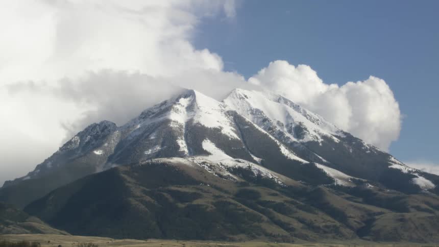 The clouds touch the peak of the mountain ranage