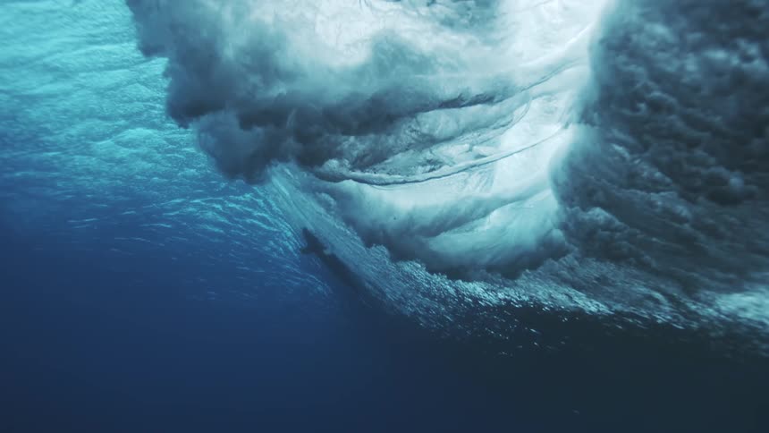 Submerged ice surface reveals trapped bubbles beneath the clear water