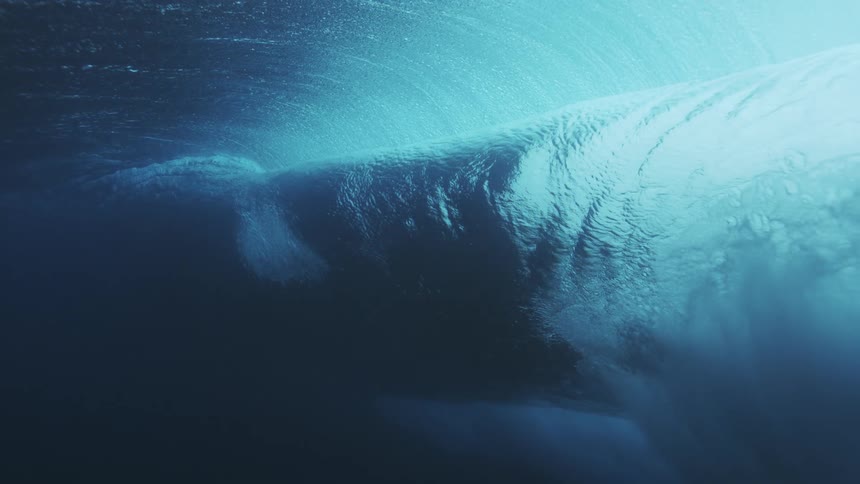 Ocean waves violently clash creating a rough foamy water body deep in the ocean