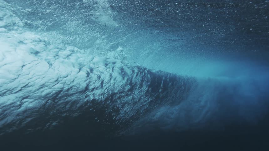 The deep ocean water violently forms waves at midday surging with power at midday
