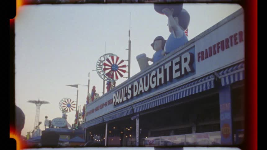 People walk past the large restaurant building
