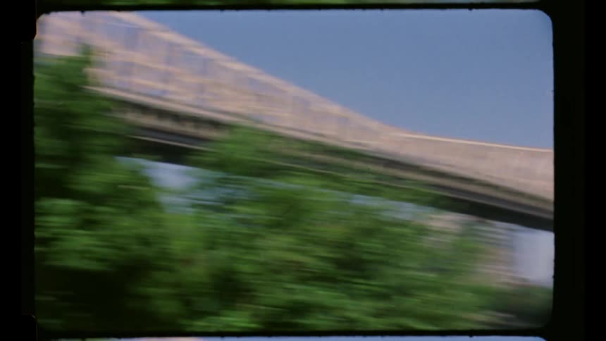Bridge crosses the river near downtown on a sunny summer day