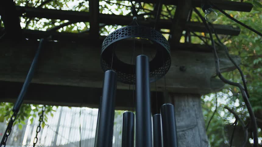 A wind chime sways in the breeze