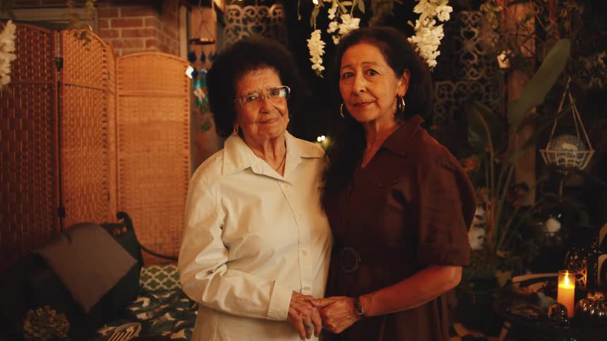 Two women pose for a photo