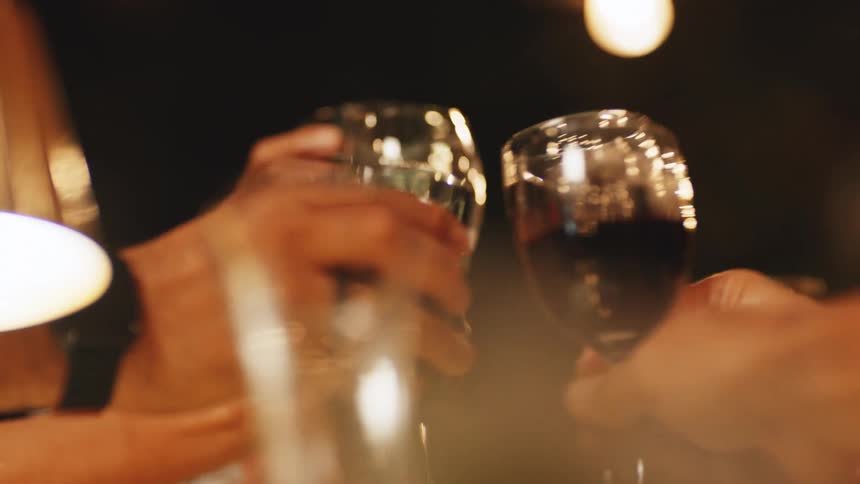 People toast their glasses of wine