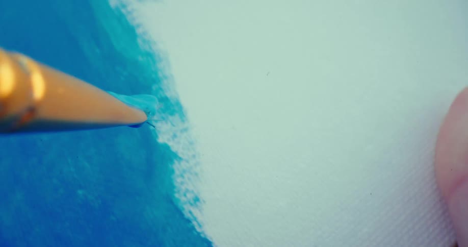 A paintbrush marks the canvas with blue