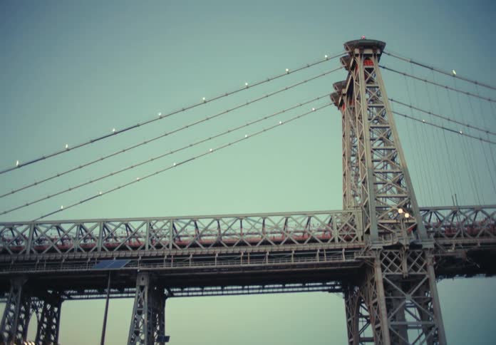 A tall bridge is over the park