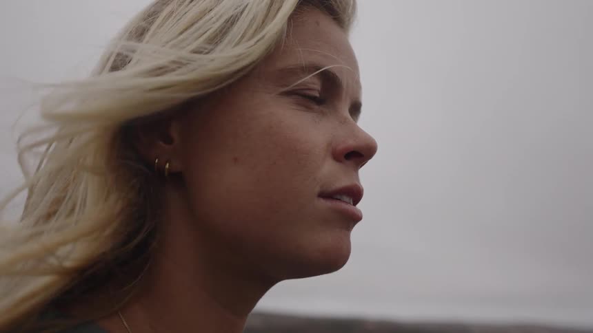 A woman looks to the right