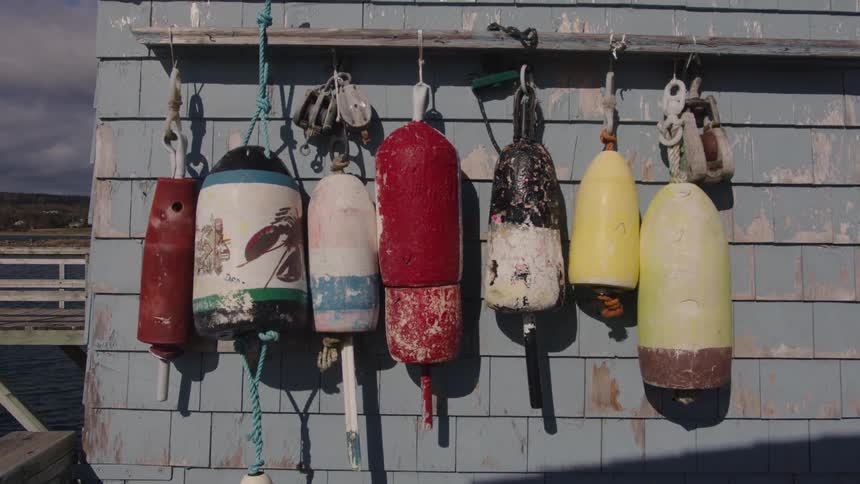 The anchors hang by the pier