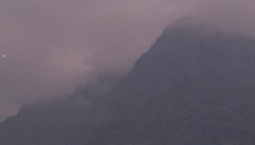 Clouds hang low on the mountain