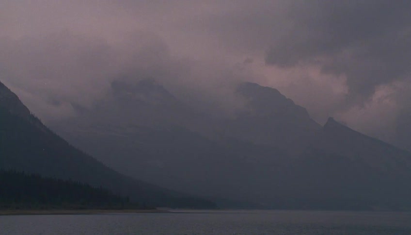 Clouds hang low over the mountains