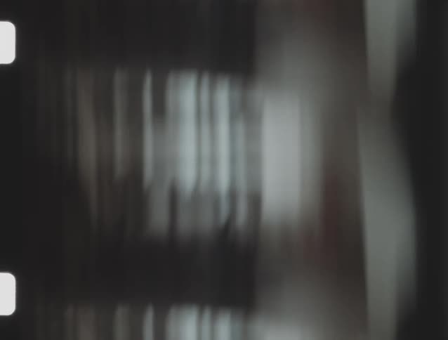 Blurred darktoned film with visible perforated edges
