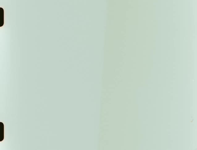 Blank film frame with perforated edges visible on the left