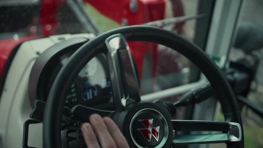 The man is driving a tractor