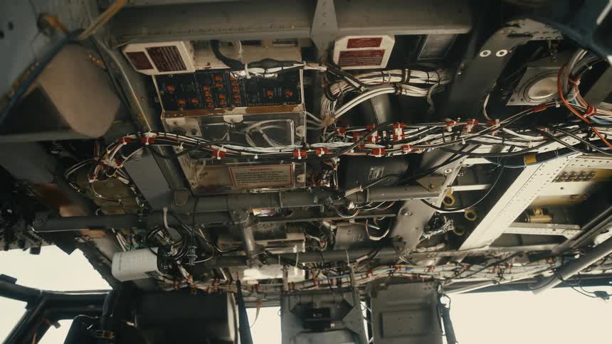 The cockpit is covered in switches and wires