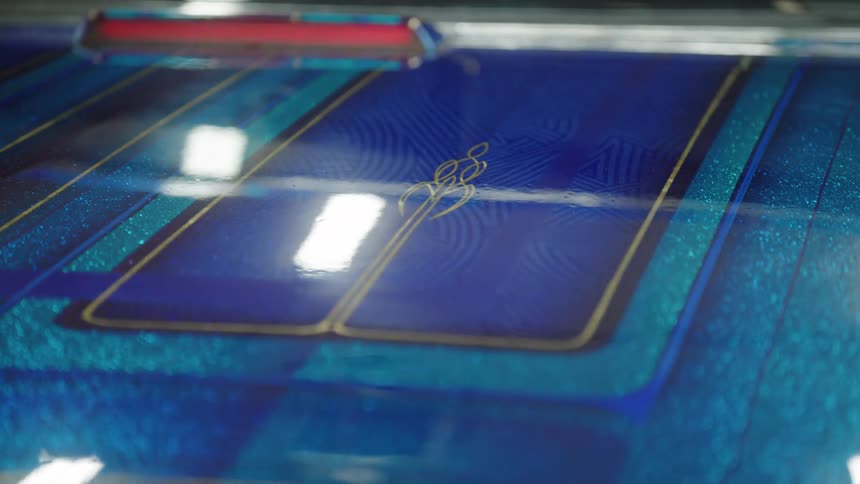 Closeup of blue printed circuit board design under bright light