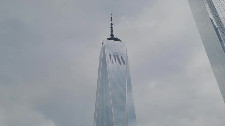 The tall building has reflective windows