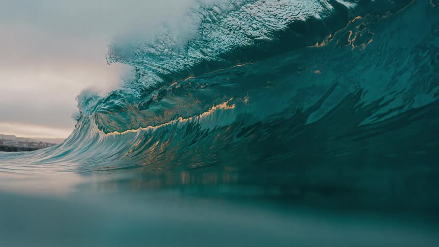 Powerful sea waves crash heavily into the ocean at midday