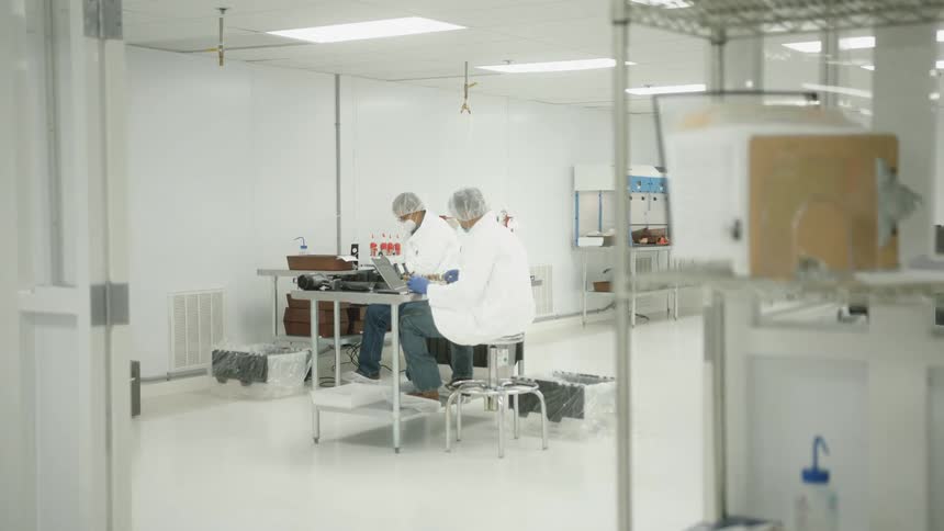 Two men work in the lab together