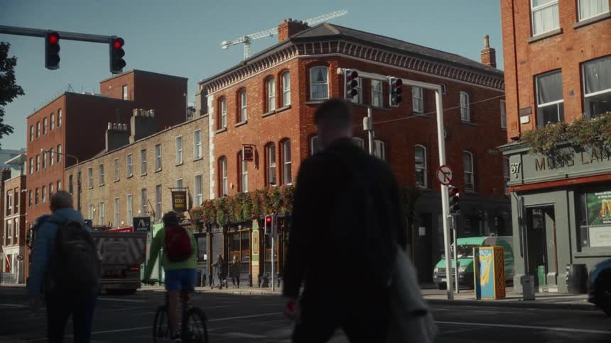 Pedestrians and vehicles travel in the city