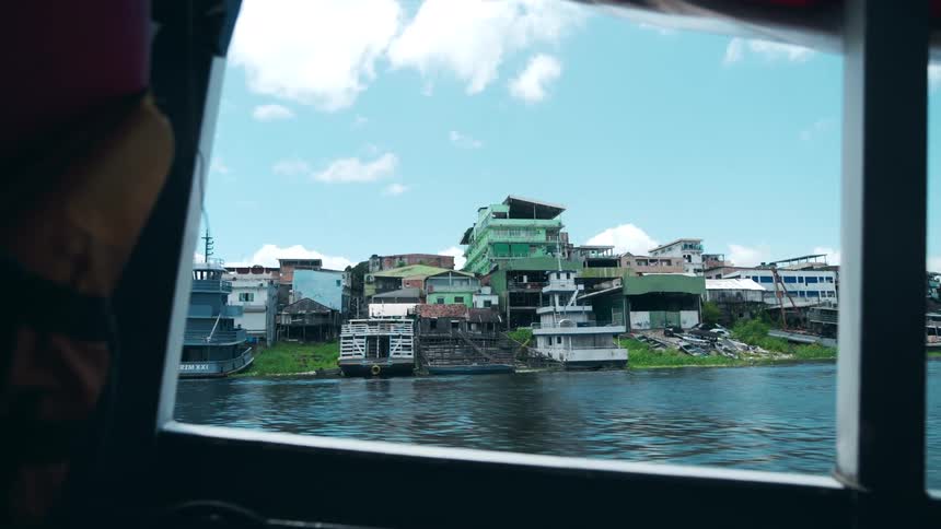 The boat passes by in the channel of the city