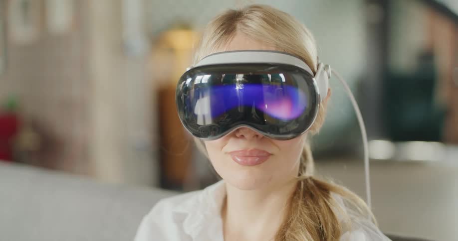 A blonde woman wearing a virtual reality headset