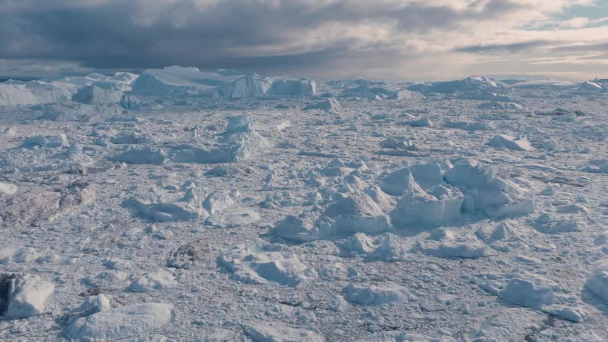 Sunlight shines on snow and ice across the arctic