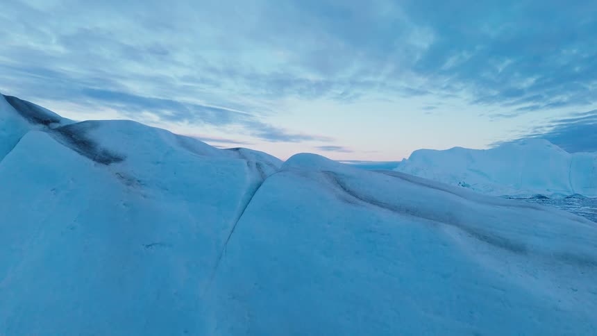 Melting glaciers and icebergs with ice floating on arctic water