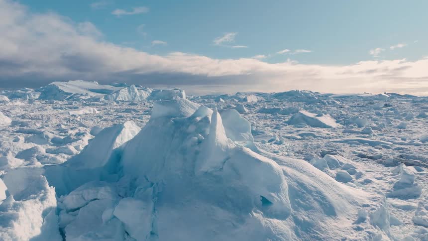 Sunlight shines on snow and ice across the arctic