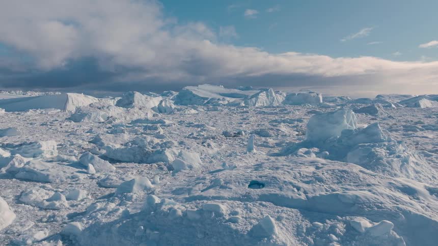 Sunlight shines on snow and ice across the arctic