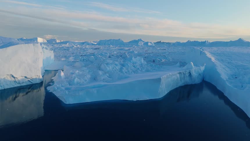 Glaciers and icebergs with melting ice on the arctic coast