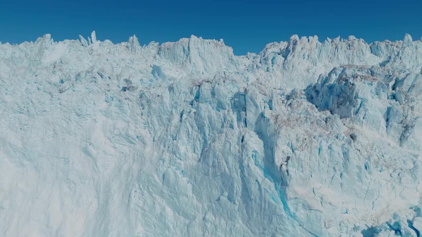 Sunlight shines on an arctic glacier mountain