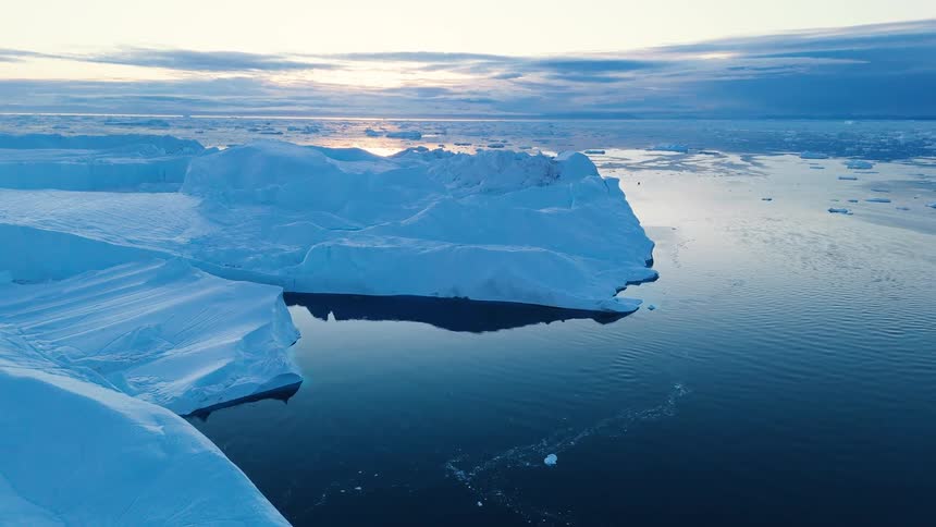 Aerial view of ice floating on the water off the arctic coast