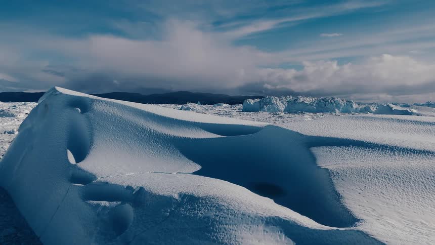 Sunlight shines on snow and ice across the arctic