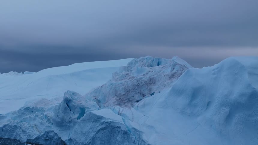 Melting ice floats along the arctic coast