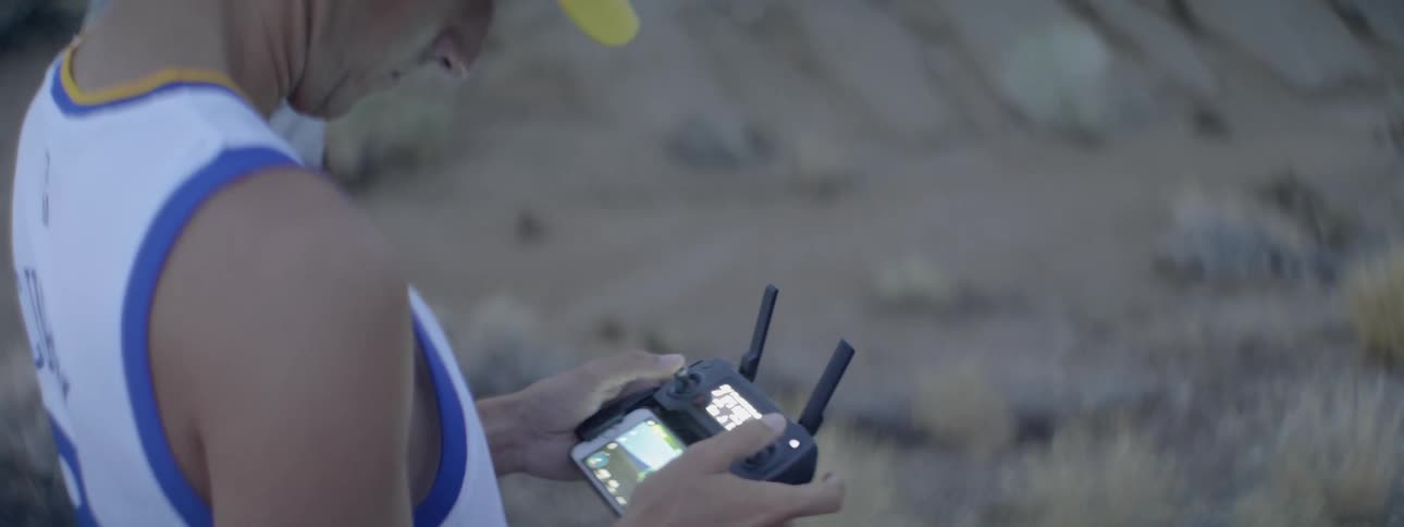 Man looks at an electronic gadget