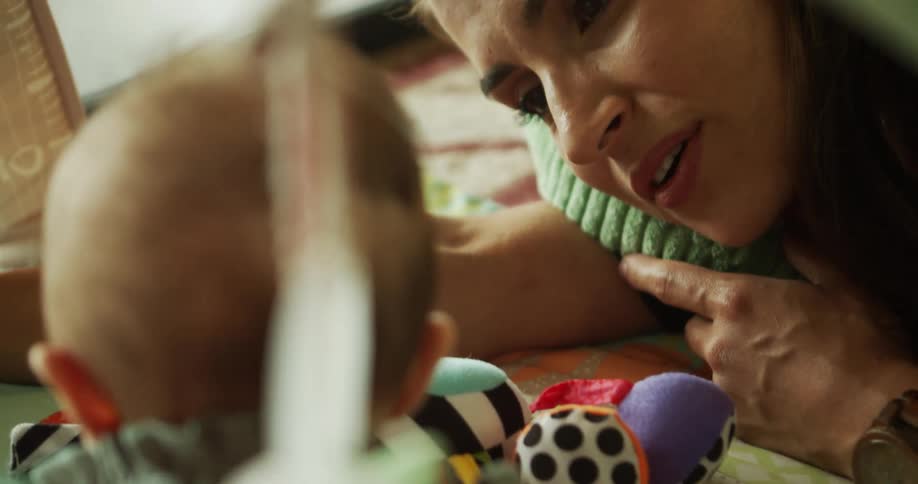 The video is a closeup shot of a persons face as they are shown in profile a finger presumably belonging to another person is pointing towards the cheek or chin of the subject