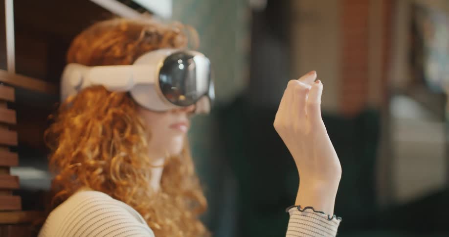 A woman enjoys virtual reality experience in modern indoor