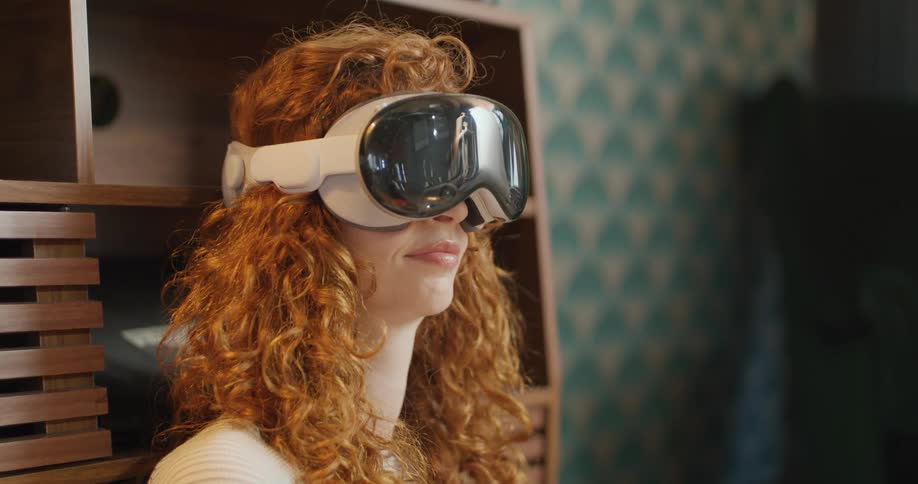 The woman is nodding her head while using a vr headset