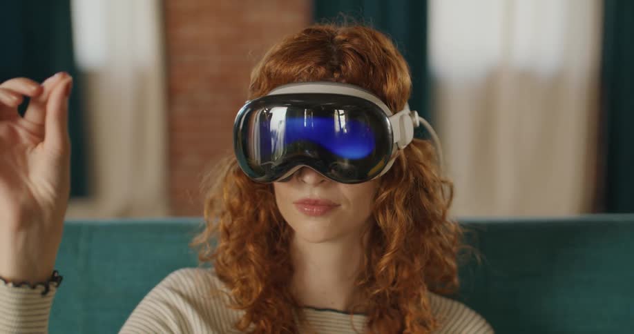 Female redhead smiles while interacting with a virtual world