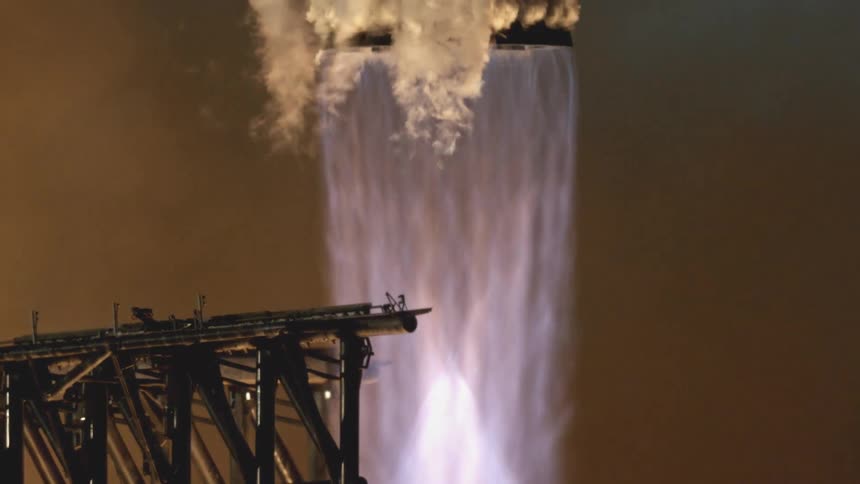 A powerful space rocket launching into the air at night