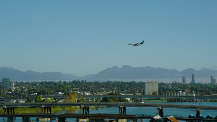 The plane is descending towards the city