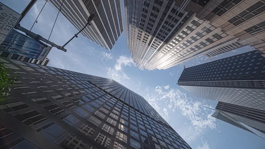 View looking up at tall buildings and skyscrapers