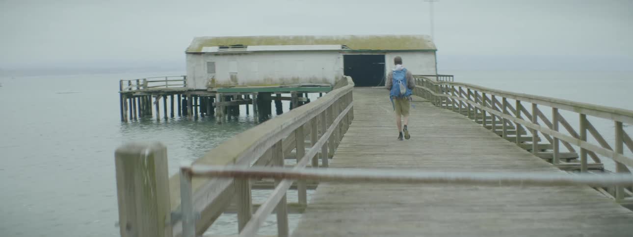 A person walks out onto the pier