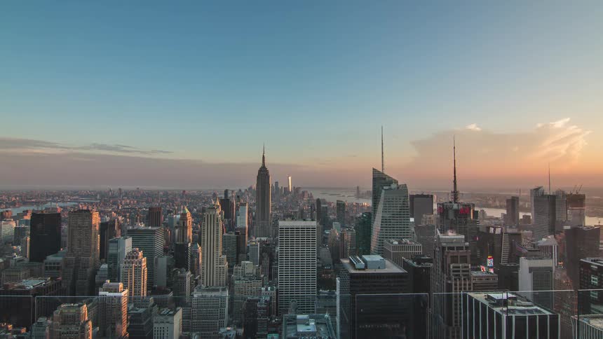 Cityscape with dense skyscrapers and the empire state building at twilight