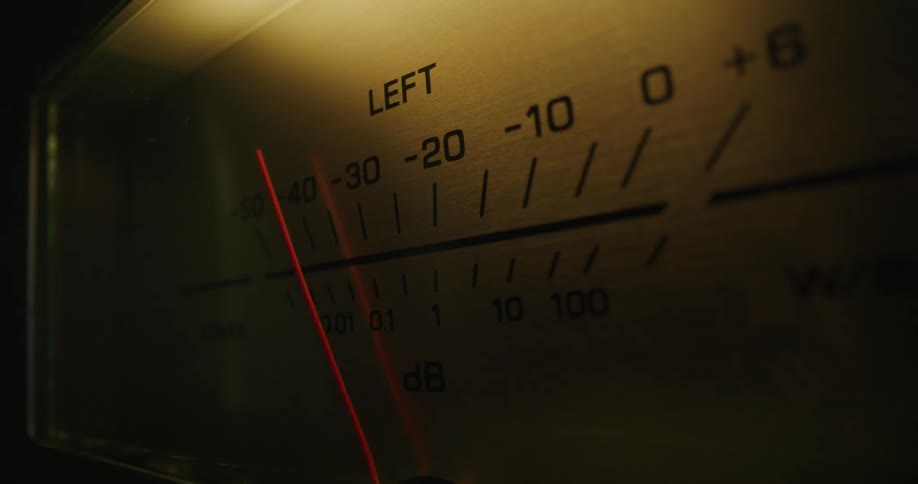 The video is an extreme closeup of a vintagestyle audio level meter specifically displaying the left channela bright red needle rapidly swings to the left indicating a drop or absence of sound input
