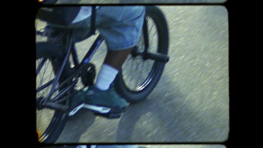 Person rides a bicycle on the road during the day
