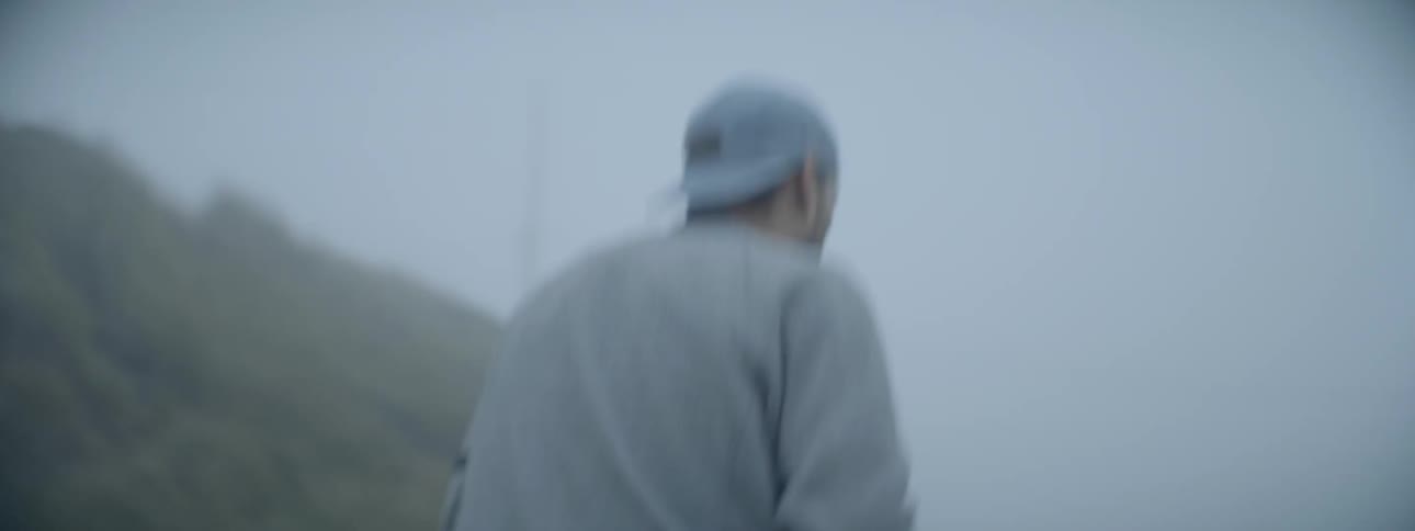 A man is hiking on the beach taking photos