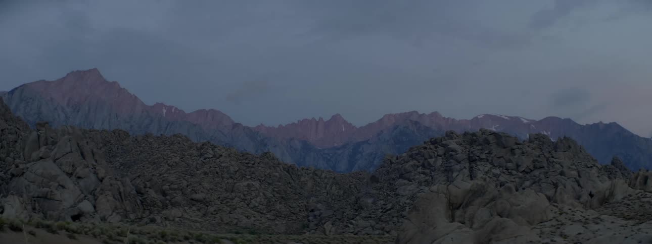 Crumbled rocky mountains near dusk
